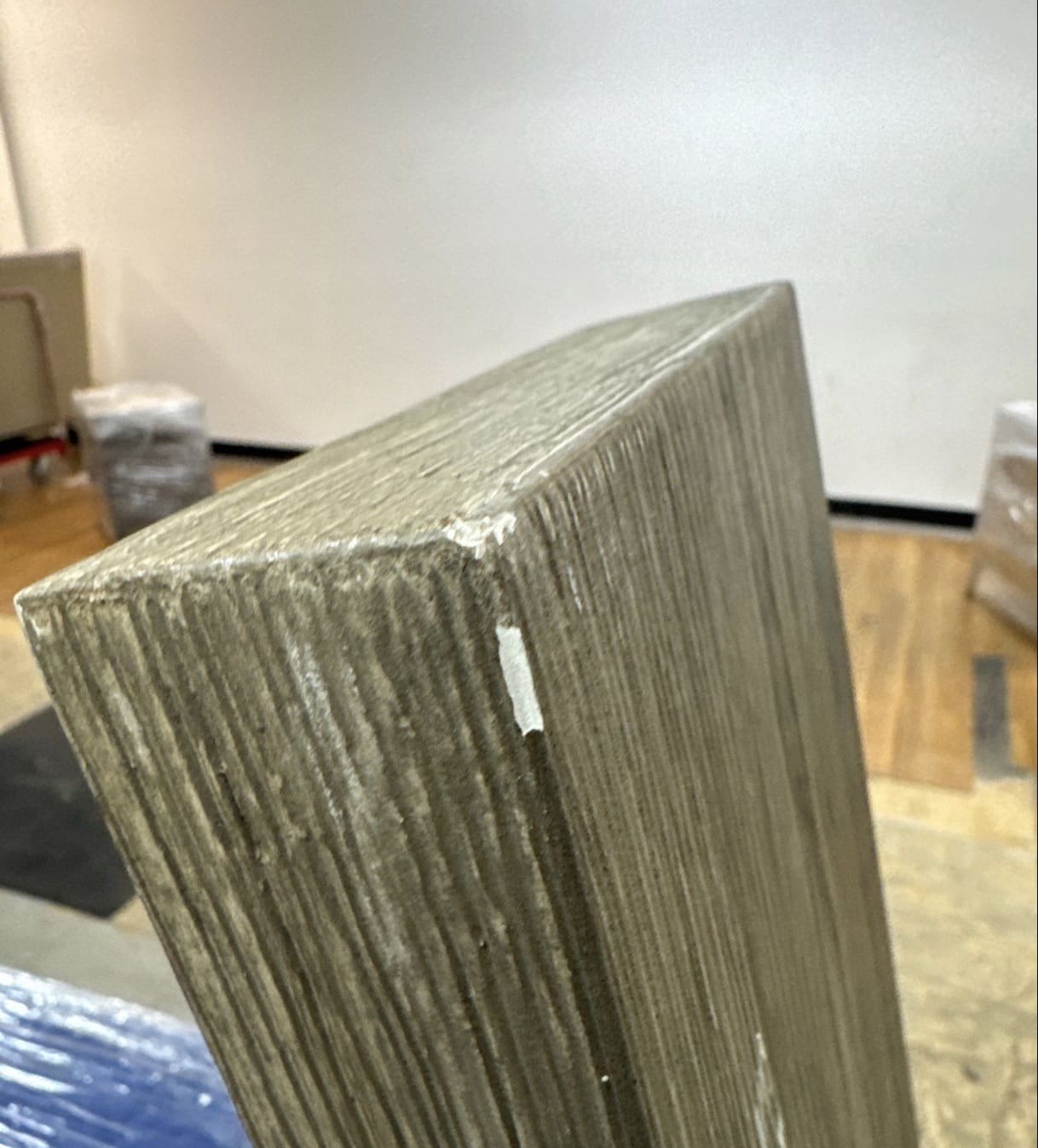 Picture of a damaged teak table leg